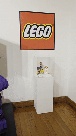 Museum visitors document LEGO and traditional exhibits in Iquique