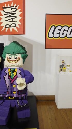 Museum visitors document LEGO and traditional exhibits in Iquique