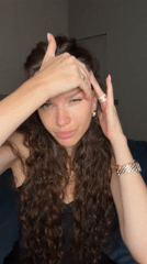 Close-up selfie-style shots, black top, jewelry, facing camera