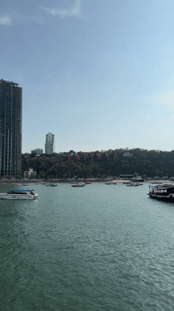 Tourist captures sunny view of Pattaya's iconic red city sign