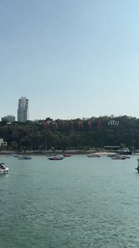 Tourist captures sunny view of Pattaya's iconic red city sign