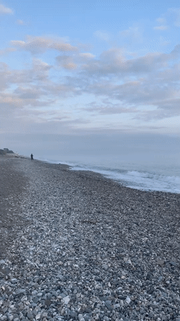 Sunset captured on empty pebble beach in Abkhazia