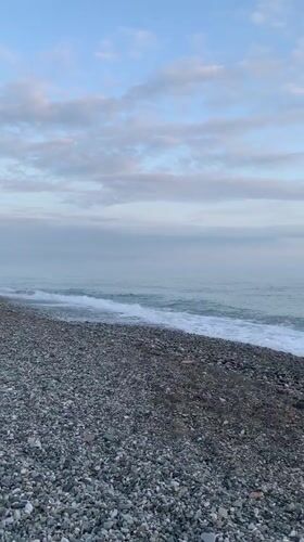 Sunset captured on empty pebble beach in Abkhazia