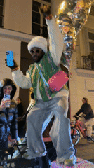 Street performer draws crowds during nighttime celebration in Paris