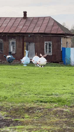 Rural Russian homes display colorful animal, cartoon lawn ornaments