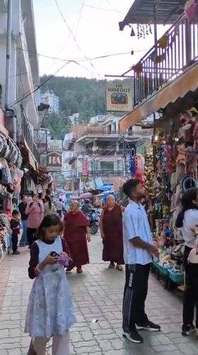 Street scenes captured in bustling Bhagsu marketplace and alleyways