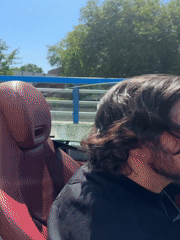Convertible drives through The Hague city center on sunny afternoon