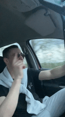 Young men drive through Bulgarian village, driver singing
