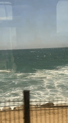 Kitesurfer spotted from train near Barcelona coast