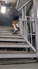 Morning at a sports facility: stairs, ice rink, turf field.