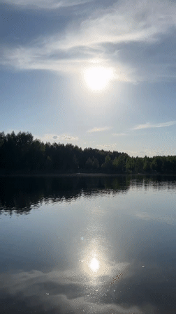Sunny afternoon lake recreation captured in Novyi, Russia
