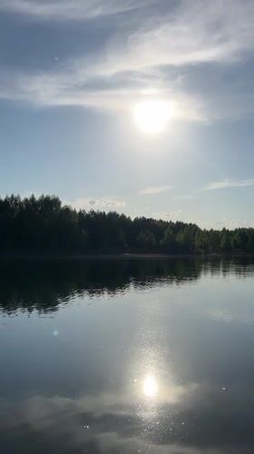 Sunny afternoon lake recreation captured in Novyi, Russia