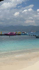 Early morning coastal activity documented at Indonesian beach location