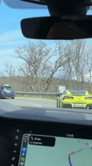 Yellow Corvette follows Mini Cooper on Bulgarian coastal road