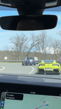 Yellow Corvette follows Mini Cooper on Bulgarian coastal road