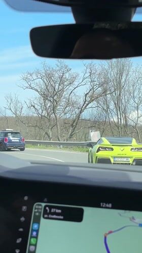 Yellow Corvette follows Mini Cooper on Bulgarian coastal road