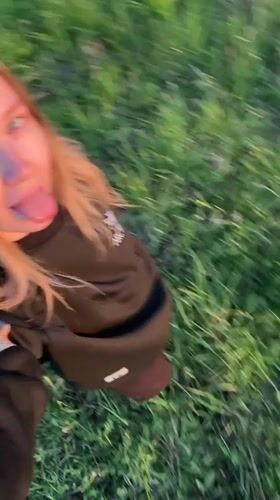 Young women spend afternoon in grassy field in Zhigalki