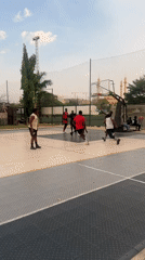 Basketball games and casual socializing documented in Abuja