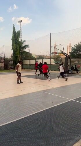 Basketball games and casual socializing documented in Abuja