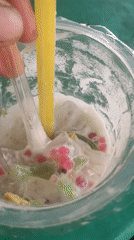 Indonesian street food spread: fried fish, curry, and iced dessert drinks