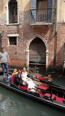 Wedding couple and tourists crowd Venice canals and streets
