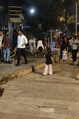 Evening fitness activities at illuminated Mumbai public park