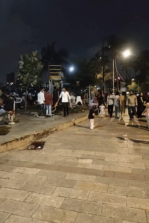 Evening fitness activities at illuminated Mumbai public park