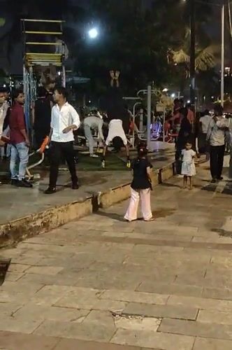 Evening fitness activities at illuminated Mumbai public park