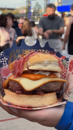 Turquoise burger served at outdoor food event in Barcelona