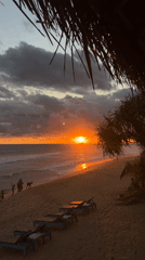 Sunset draws beachgoers to Hikkaduwa shoreline in Sri Lanka