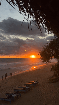 Sunset draws beachgoers to Hikkaduwa shoreline in Sri Lanka