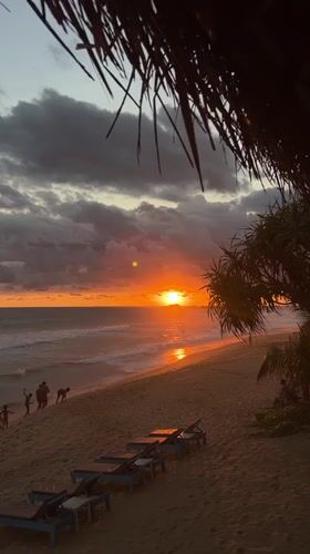 Sunset draws beachgoers to Hikkaduwa shoreline in Sri Lanka