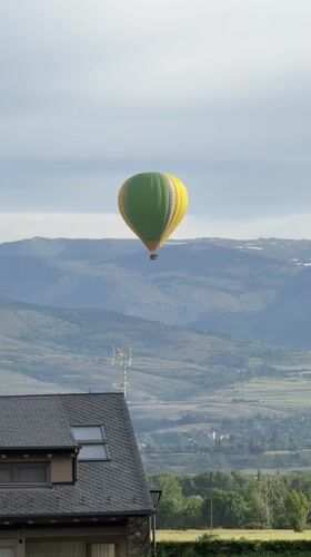 Hot air balloon spotted over Spanish Pyrenees mountains