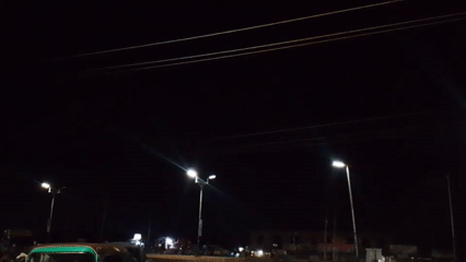Nighttime street activity documented in Bukuru, Nigeria