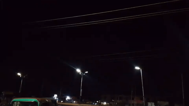 Nighttime street activity documented in Bukuru, Nigeria
