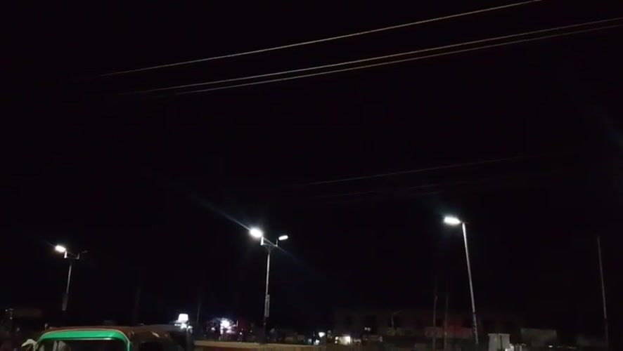 Nighttime street activity documented in Bukuru, Nigeria