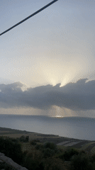 Dramatic sunset rays captured over Ayir Morocco coastline