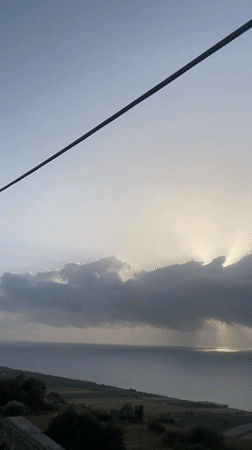 Dramatic sunset rays captured over Ayir Morocco coastline