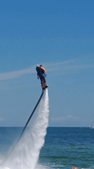 Ukrainian coastal communities host morning flyboarding and beach recreation