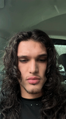 Young person recorded in close-up video inside car