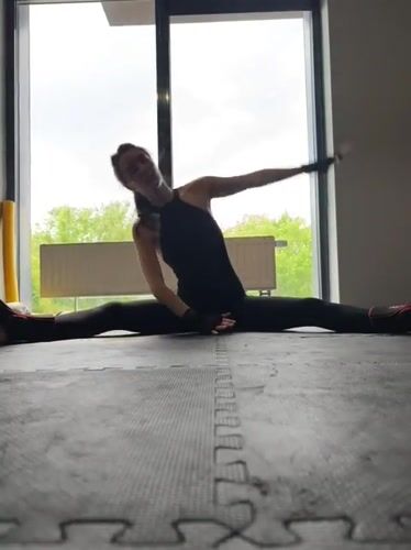 Woman conducts morning fitness routine in Tyumen gym