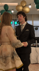Formal dance gathering documented in Sofia ballroom setting