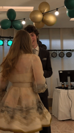 Formal dance gathering documented in Sofia ballroom setting
