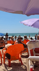 Sunny beach day draws crowds to Tel Aviv shore