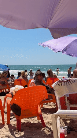 Sunny beach day draws crowds to Tel Aviv shore