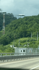 White structure spotted atop forested hill in Adlerskiy, Russia