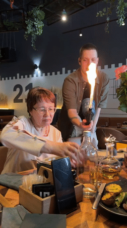 Waiter uses flaming torch for tableside service in Tyumen restaurant