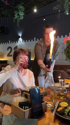 Waiter uses flaming torch for tableside service in Tyumen restaurant