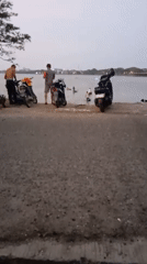Casual waterfront moments captured in Lhokseumawe, Indonesia