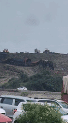 Heavy machinery at work on a Delhi landfill site